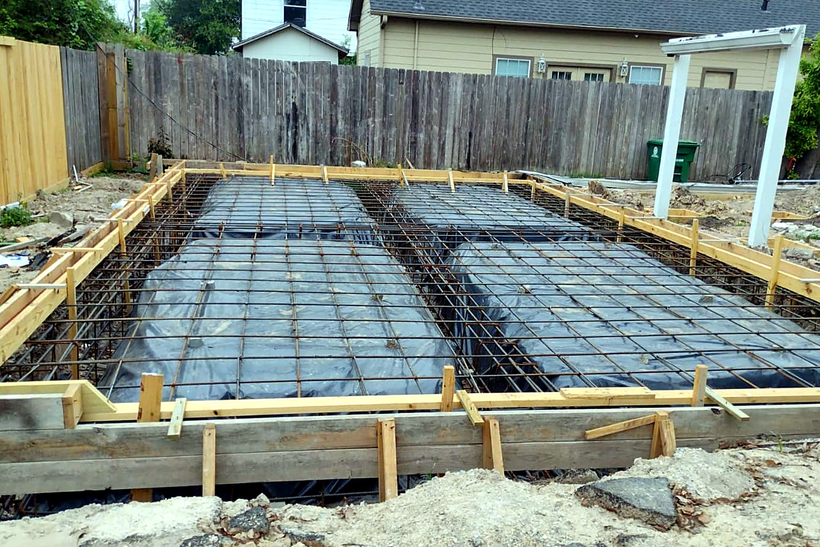Deep foundation forms with grade beams and heavy rebar reinforcement