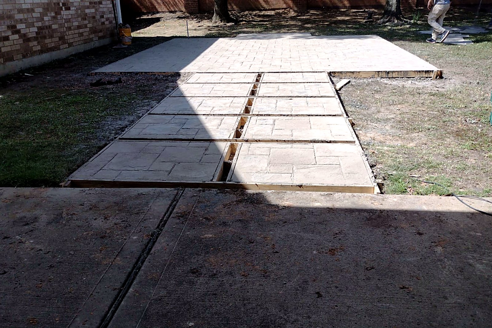 Ashlar slate stamped concrete patio in a grey and tan color blend